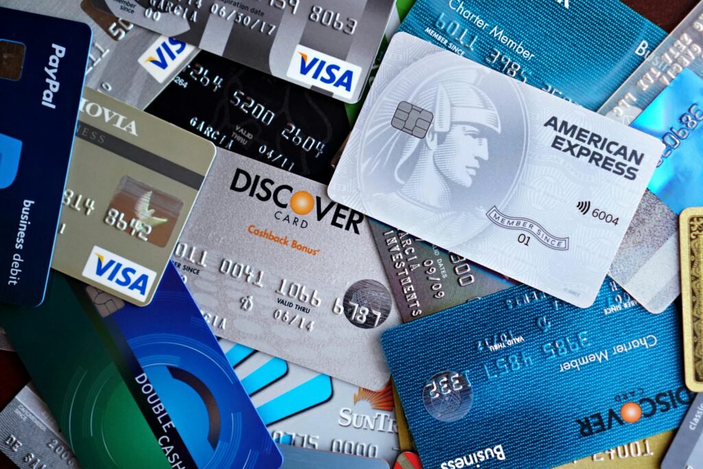 PERSONAL LOAN RATES Close-up image of various credit cards including Visa, Mastercard, and American Express.